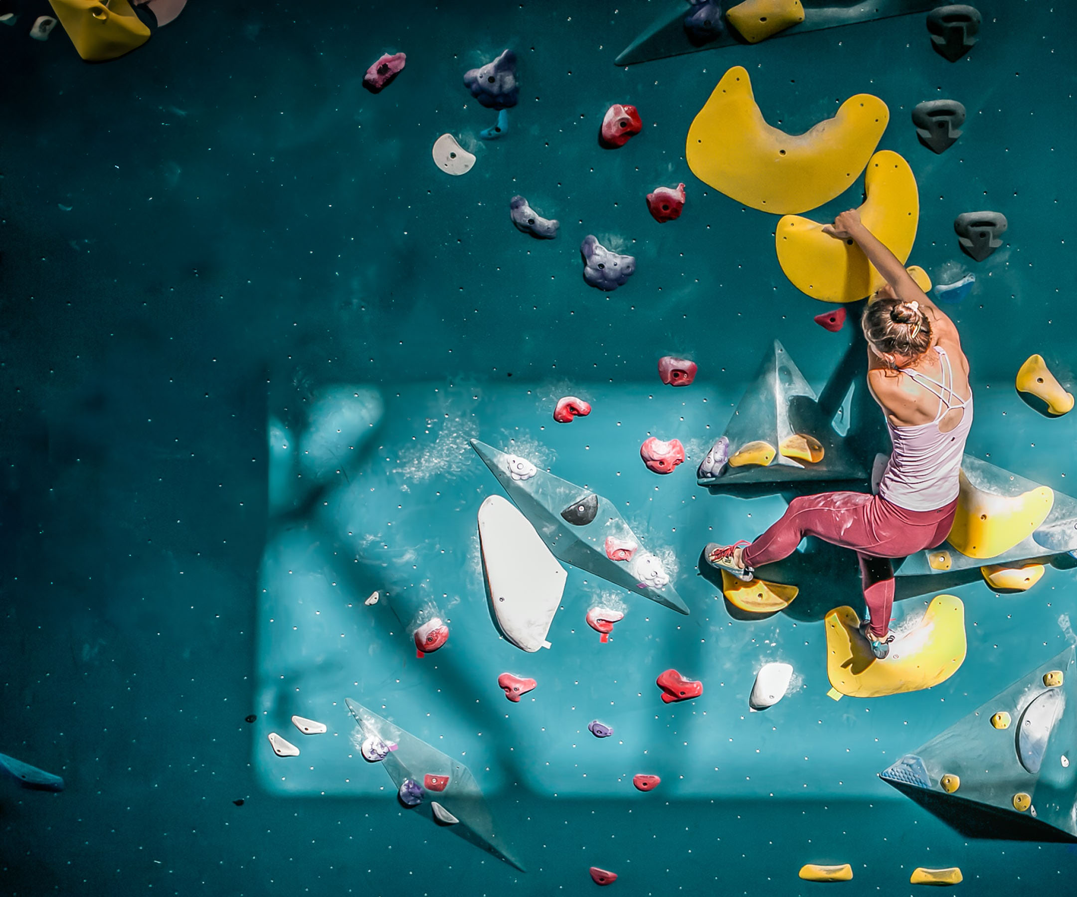 woman-climbing gym wall